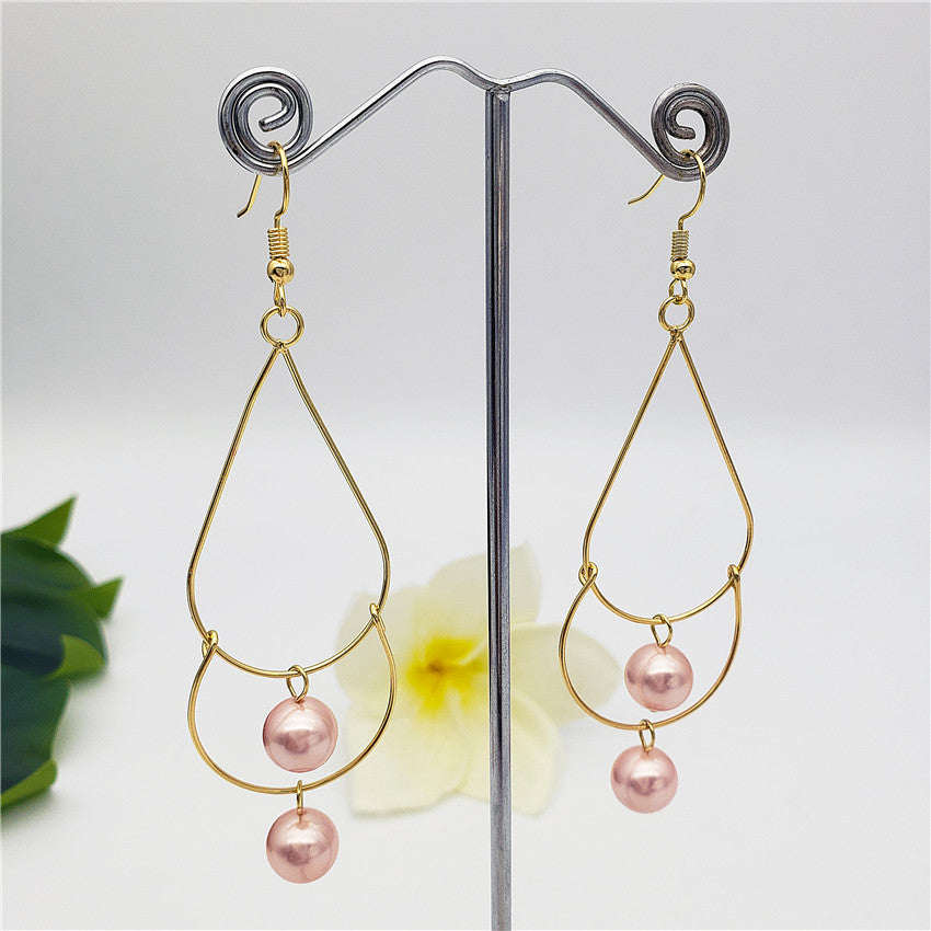 Double Teardrop Long Earrings Sustained With Pearls In Different Colors