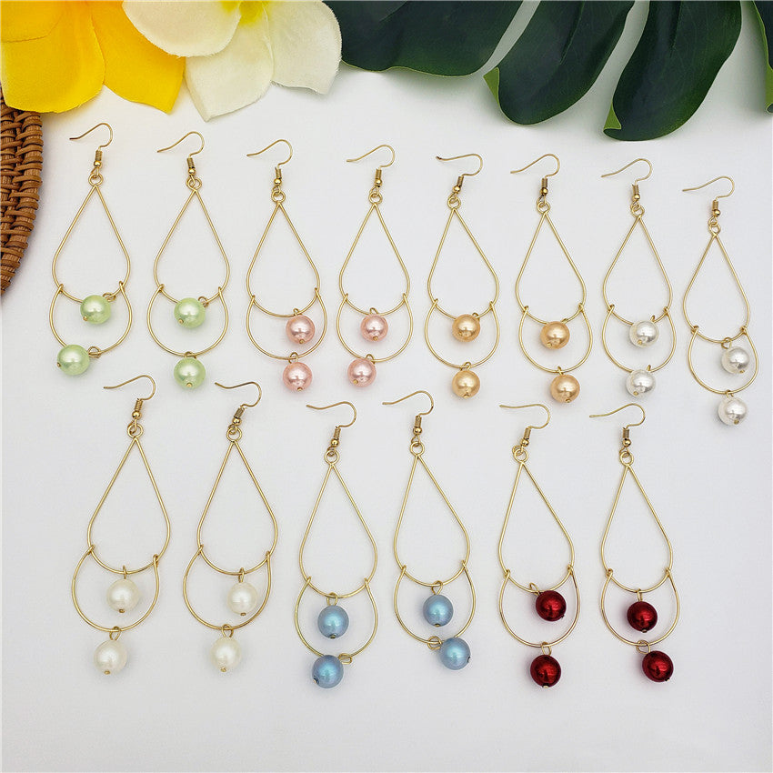 Double Teardrop Long Earrings Sustained With Pearls In Different Colors