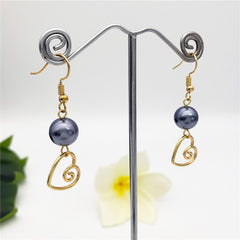 Petrol Pearl Hook Earrings Sustained With A Charm In Different Styles