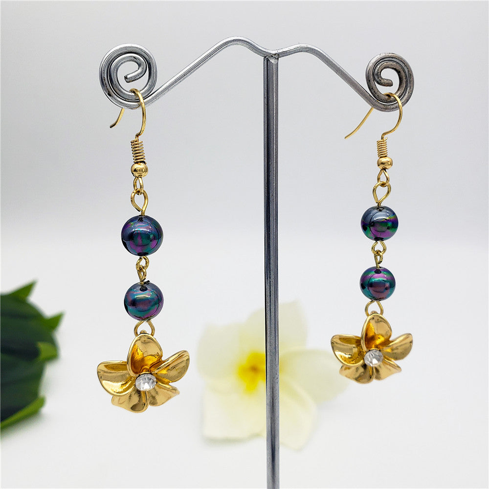 Metallic Green-Purple Pearls And Plumeria Flower Charm Centered With White Zircon Earrings