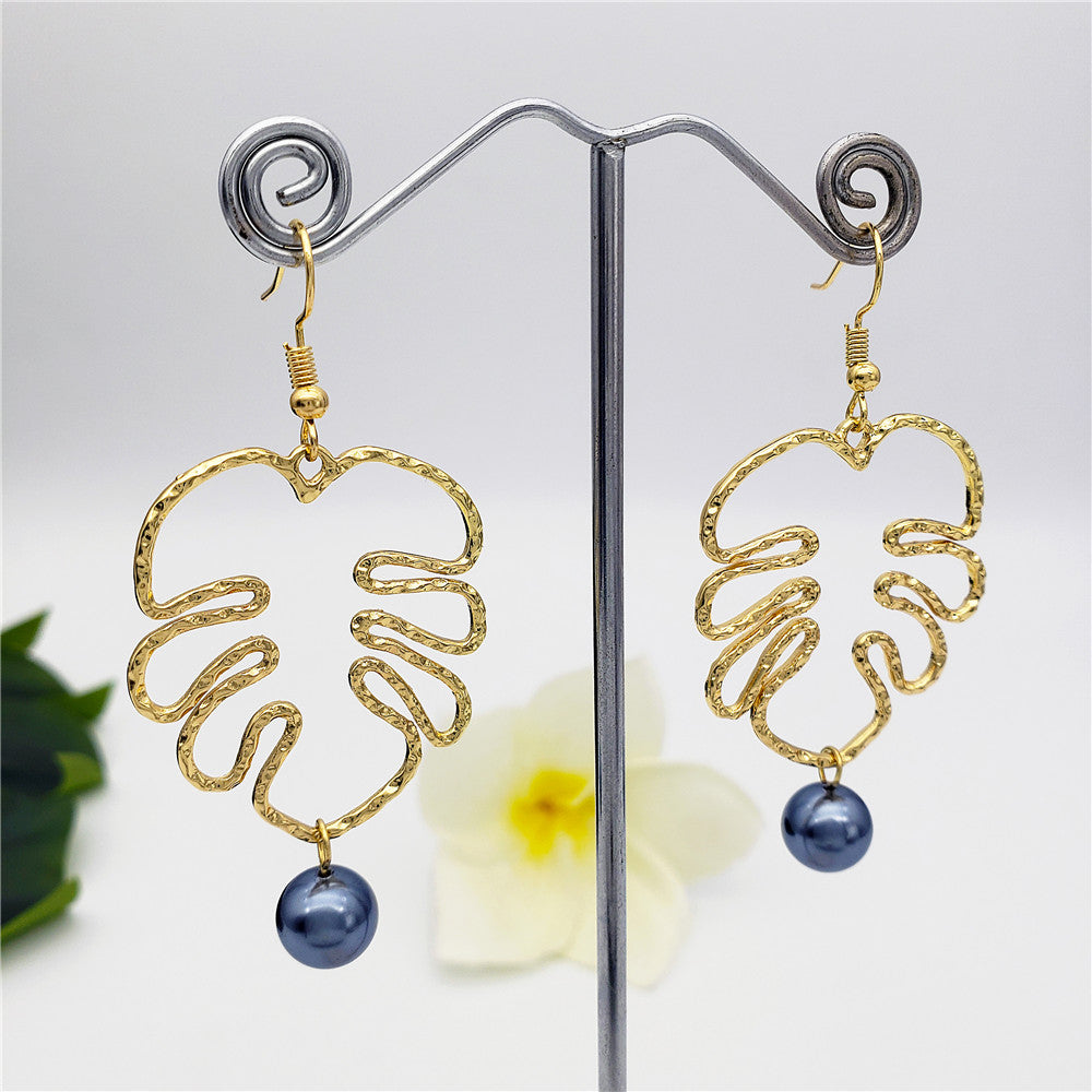 Hawaiian Monstera Leaf Earrings Sustained With A Petrol Pearl