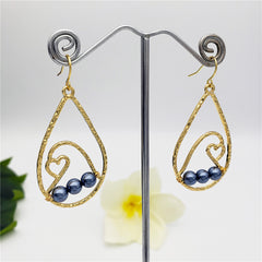 Teardrop Earrings With Petrol Pearls And A Wave Carrying A Heart