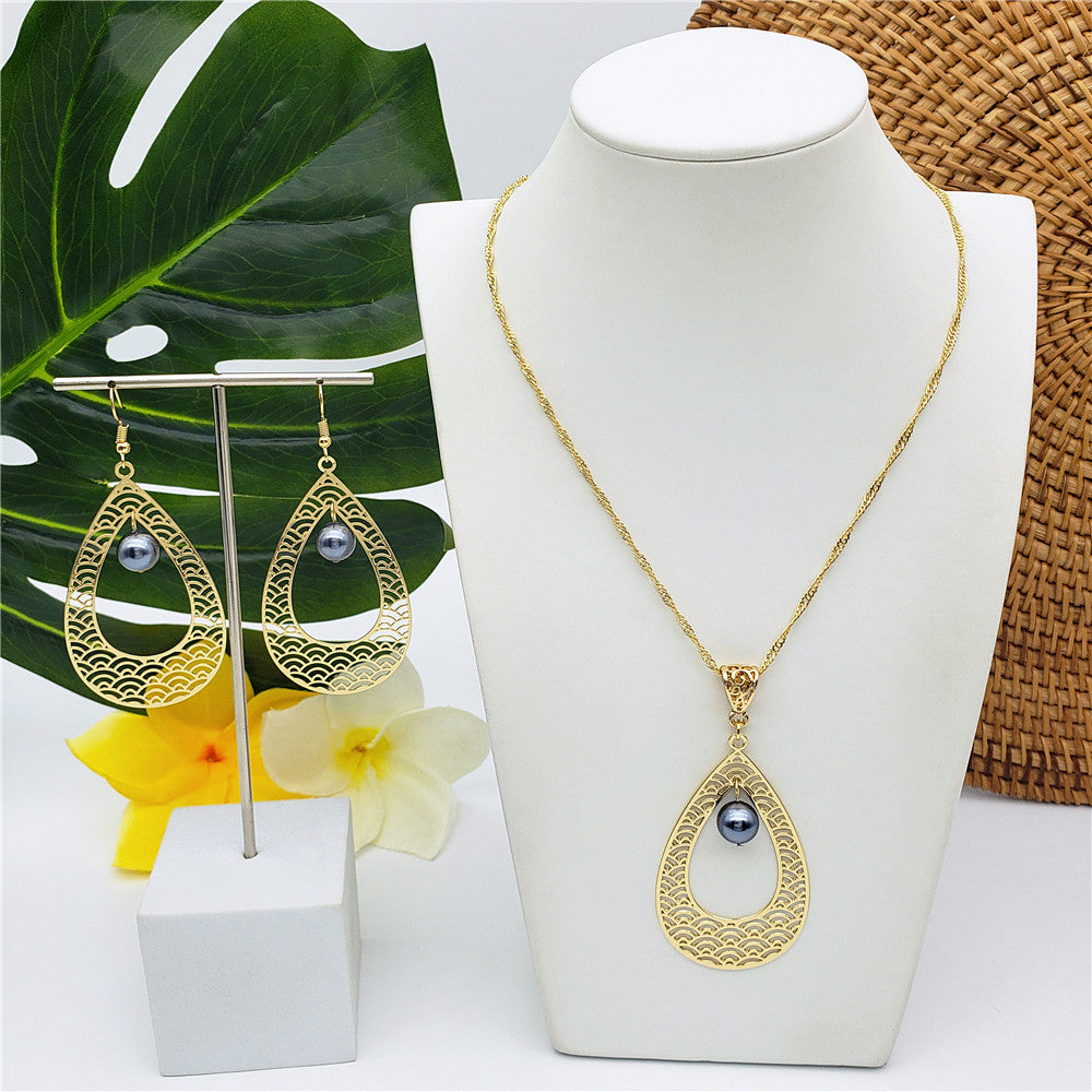 Set Of Carved Waves Double Teardrop Earrings And Necklace Sustained With A Pearl In Different Colors