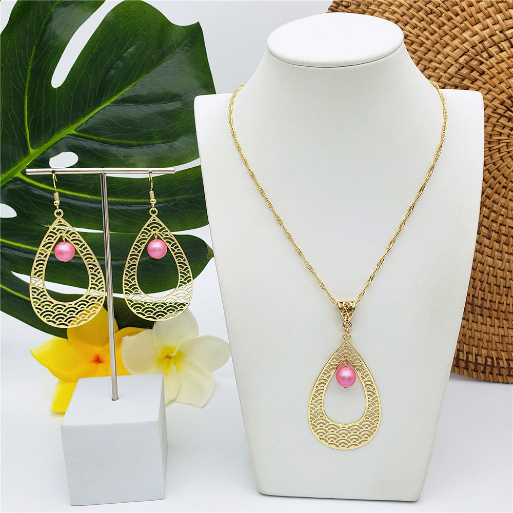 Set Of Carved Waves Double Teardrop Earrings And Necklace Sustained With A Pearl In Different Colors