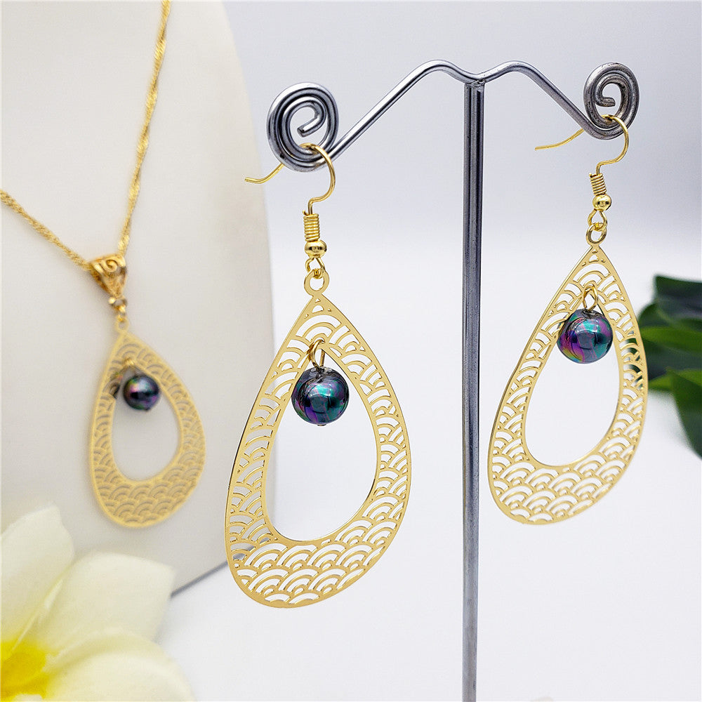 Set Of Carved Waves Double Teardrop Earrings And Necklace Sustained With A Pearl In Different Colors