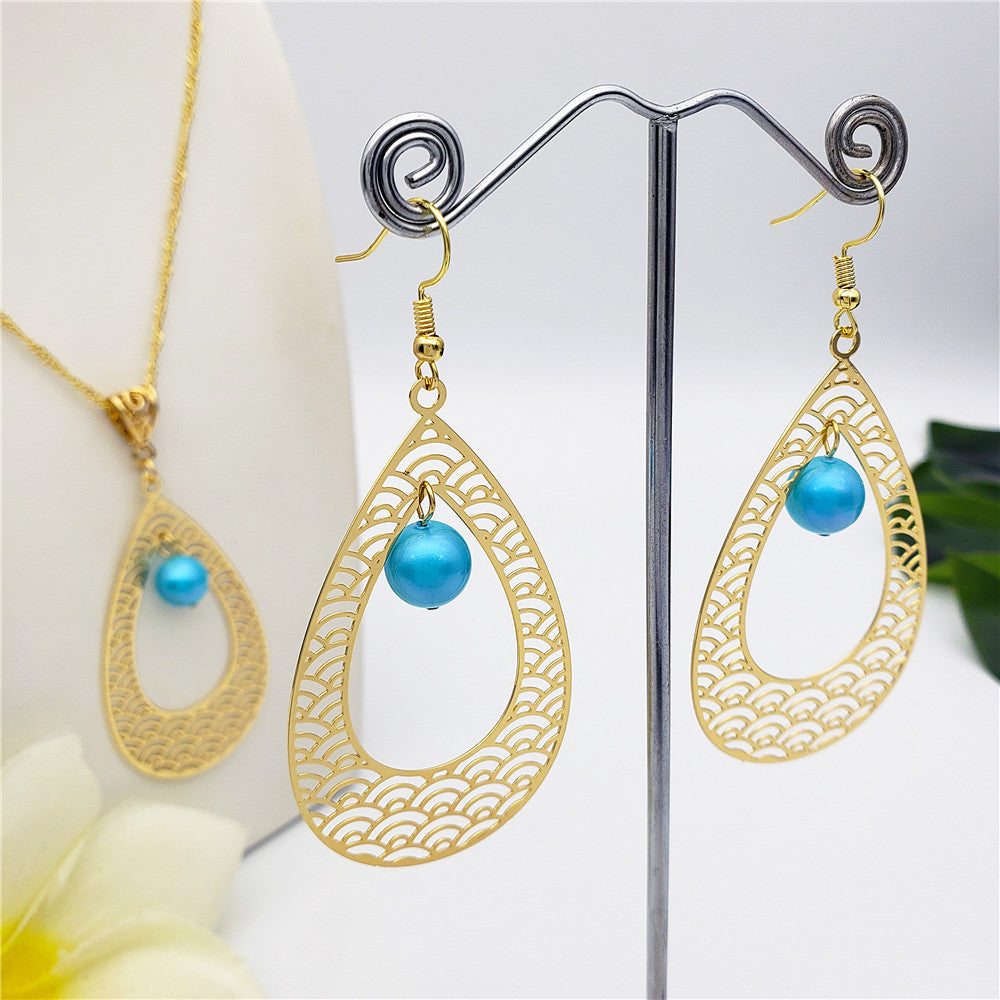 Set Of Carved Waves Double Teardrop Earrings And Necklace Sustained With A Pearl In Different Colors