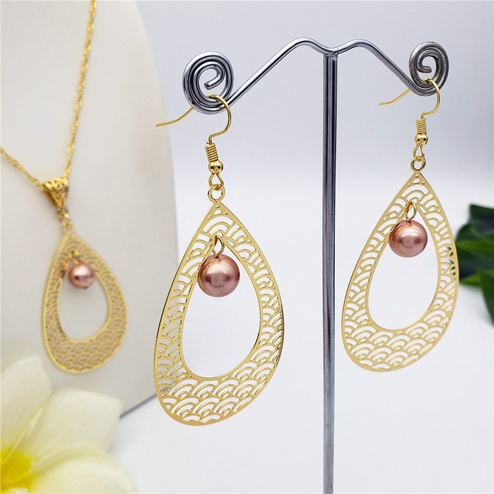 Set Of Carved Waves Double Teardrop Earrings And Necklace Sustained With A Pearl In Different Colors