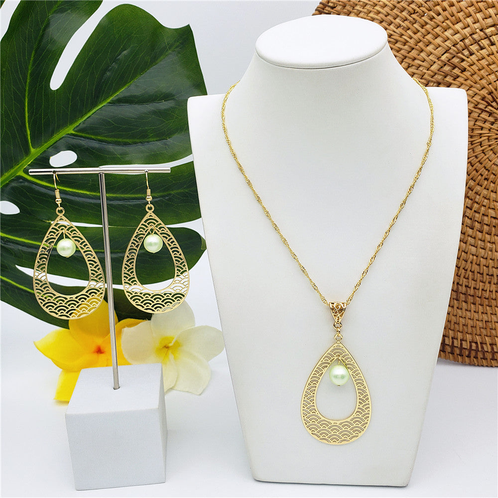 Set Of Carved Waves Double Teardrop Earrings And Necklace Sustained With A Pearl In Different Colors