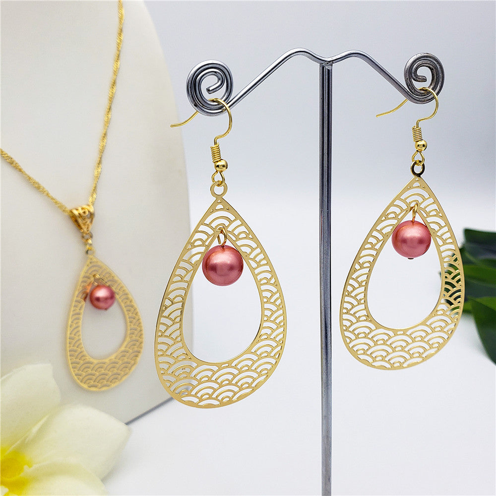 Set Of Carved Waves Double Teardrop Earrings And Necklace Sustained With A Pearl In Different Colors