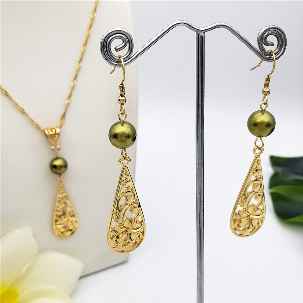 Set Of Carved Plumeria Flower And Leaves Teardrop Earrings And Necklace Sustained With A Pearl In Different Colors