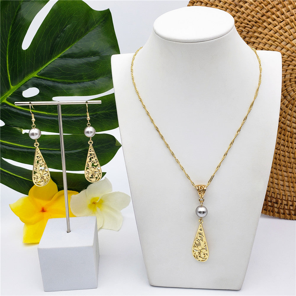 Set Of Carved Plumeria Flower And Leaves Teardrop Earrings And Necklace Sustained With A Pearl In Different Colors