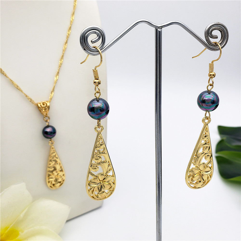 Set Of Carved Plumeria Flower And Leaves Teardrop Earrings And Necklace Sustained With A Pearl In Different Colors