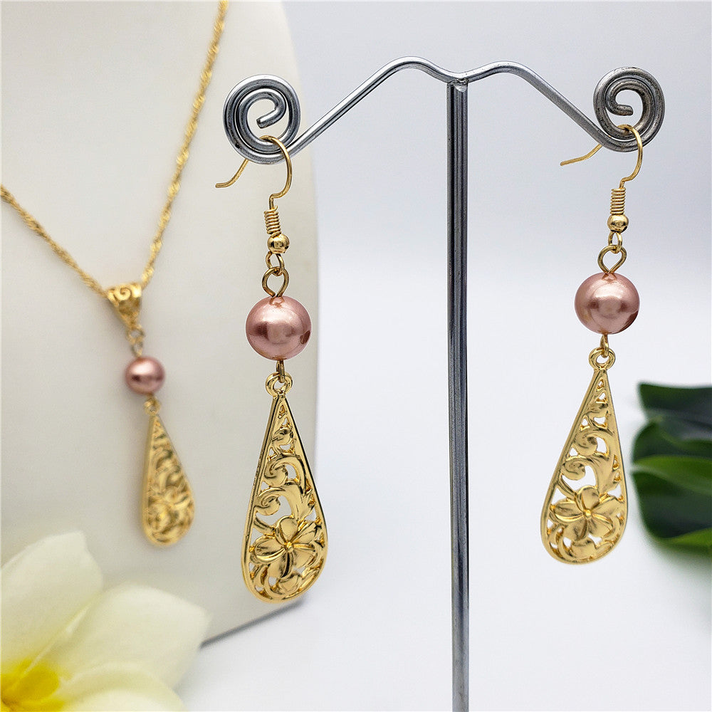 Set Of Carved Plumeria Flower And Leaves Teardrop Earrings And Necklace Sustained With A Pearl In Different Colors