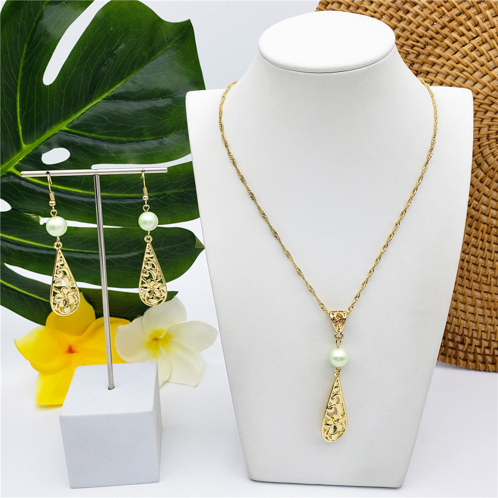 Set Of Carved Plumeria Flower And Leaves Teardrop Earrings And Necklace Sustained With A Pearl In Different Colors