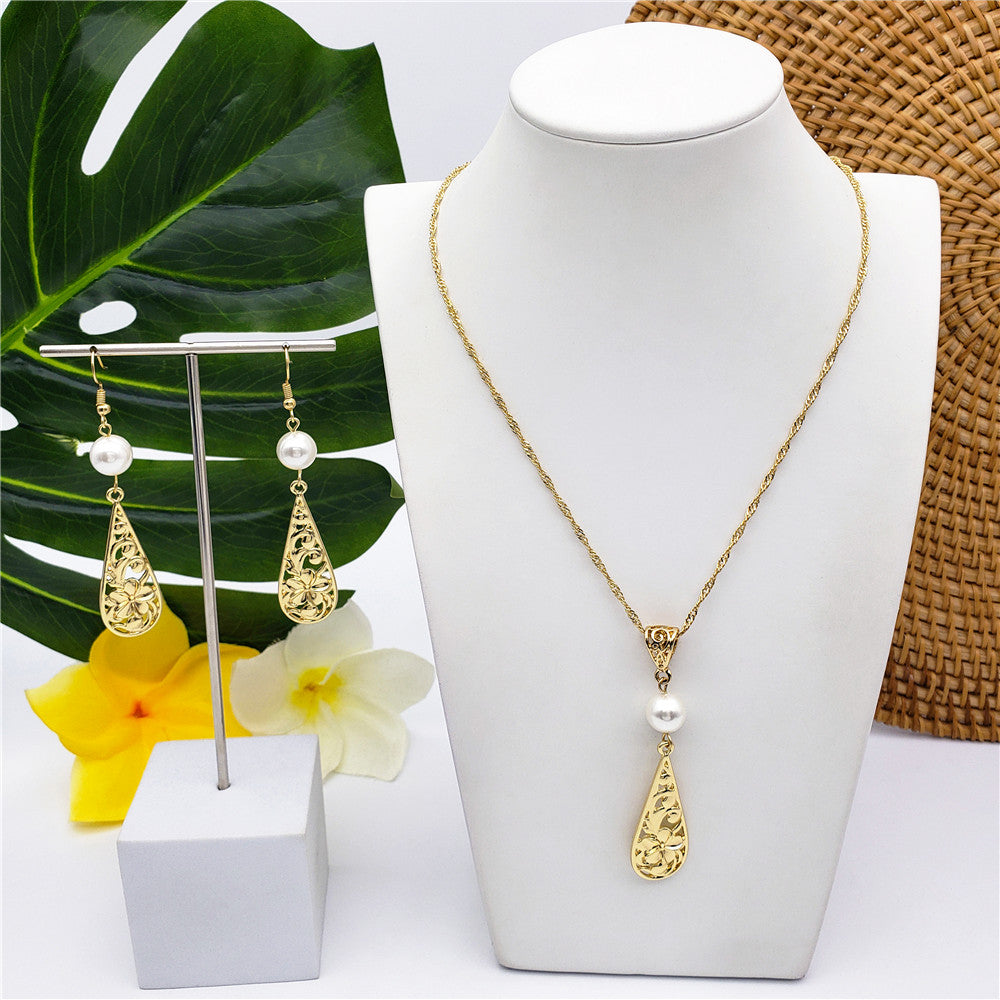 Set Of Carved Plumeria Flower And Leaves Teardrop Earrings And Necklace Sustained With A Pearl In Different Colors