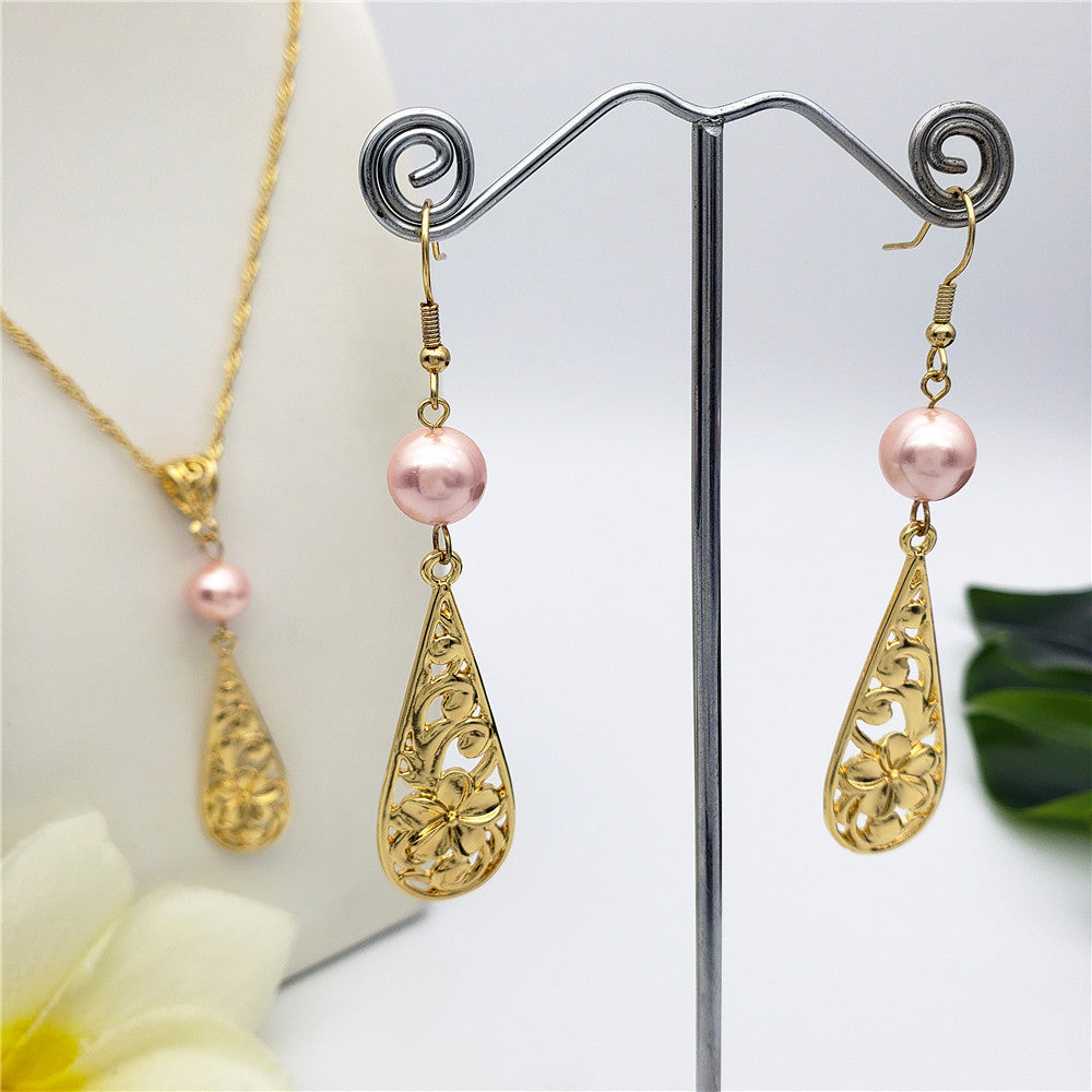 Set Of Carved Plumeria Flower And Leaves Teardrop Earrings And Necklace Sustained With A Pearl In Different Colors