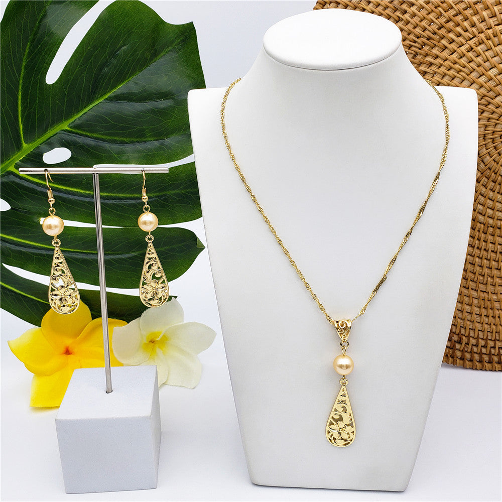 Set Of Carved Plumeria Flower And Leaves Teardrop Earrings And Necklace Sustained With A Pearl In Different Colors