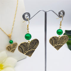 Set Of Carved Heart Earrings And Necklace Sustained With A Pearl In 2 Different Colors