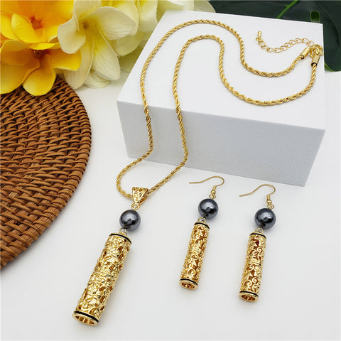 Set Of Carved Flowers & Leaves Tube Earrings And Necklace Sustained With A Petrol Pearl